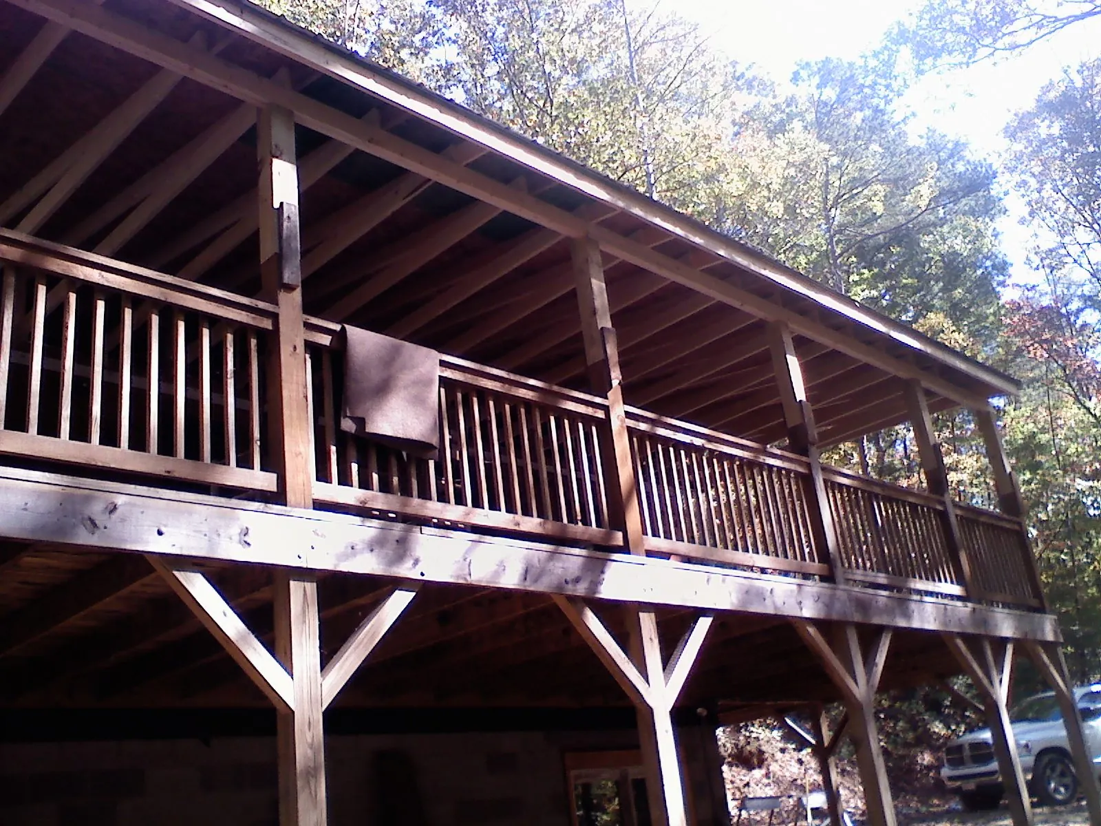 Timber framing under a new elevated porch and deck — Roof Leak Repair in Norway by Roofing Brothers